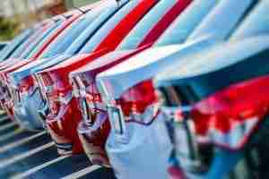 back of cars parked at car dealership