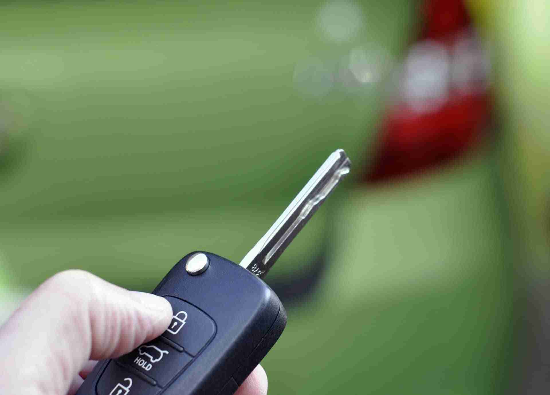 Person Pressing Car Key Fob