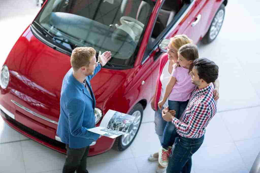 Simple Tactics to Create a Welcoming Environment in Your Dealership 9 Car Salesmen Showing Family Red Car